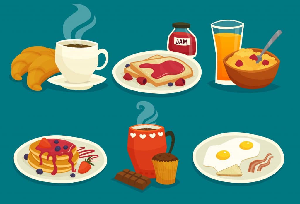 Diversas refeições sobre a mesa: café croissant, geleia, suco, panquecas, ovos com bacon e chocolate quente.